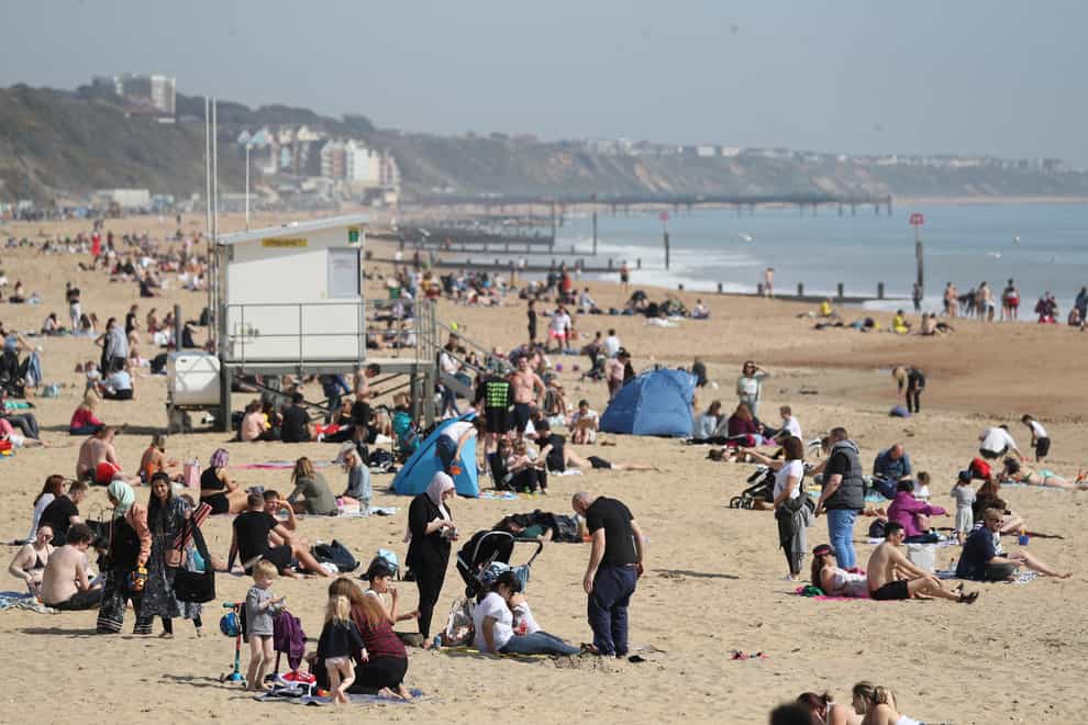 People enjoy the warm weather on Bournemouth beach