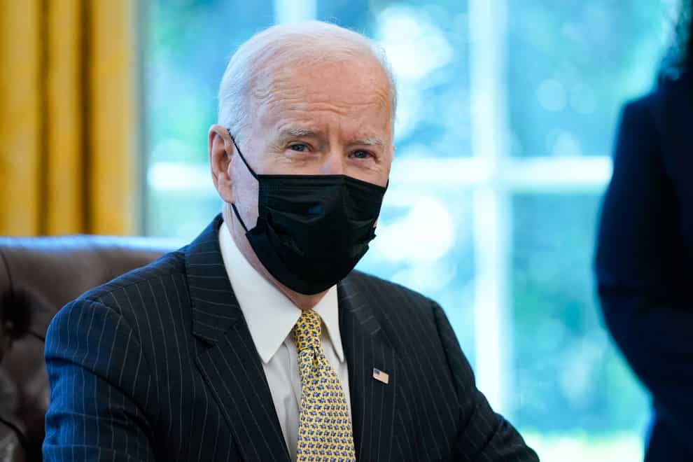 President Joe Biden sitting at a desk
