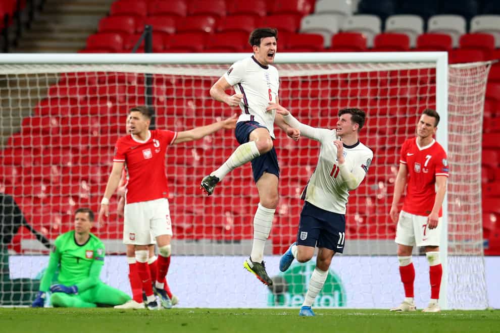 Harry Maguire (centre) celebrates scoring England's second goal of the game during the 2022 FIFA World Cup Qualifying match at Wembley Stadium, London