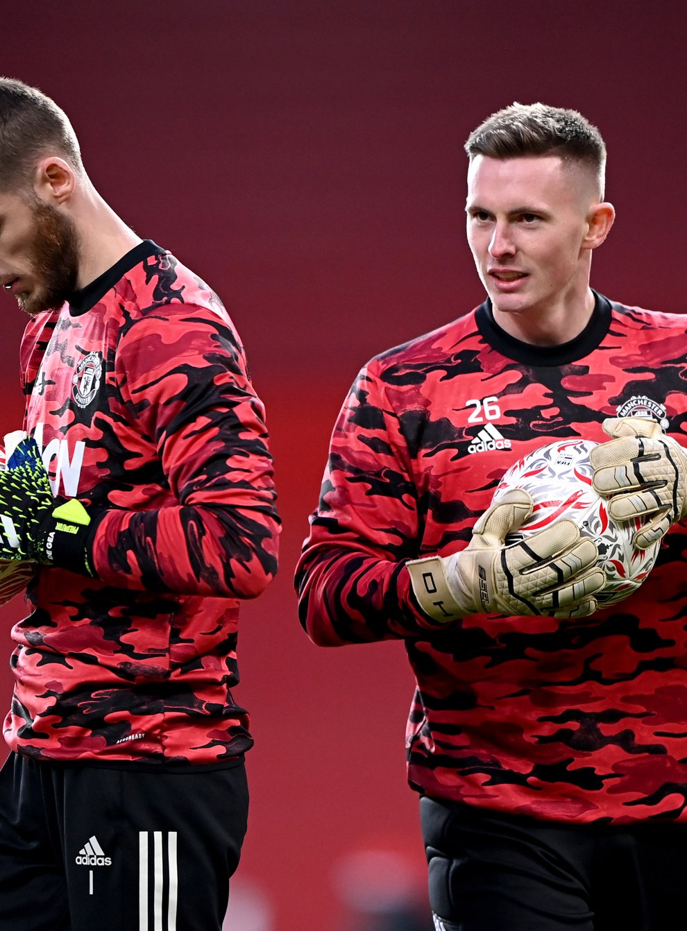A question mark hangs over which of David De Gea (left) or Dean Henderson (right) will play in goal for Manchester United against Brighton (Laurence Griffiths/PA).