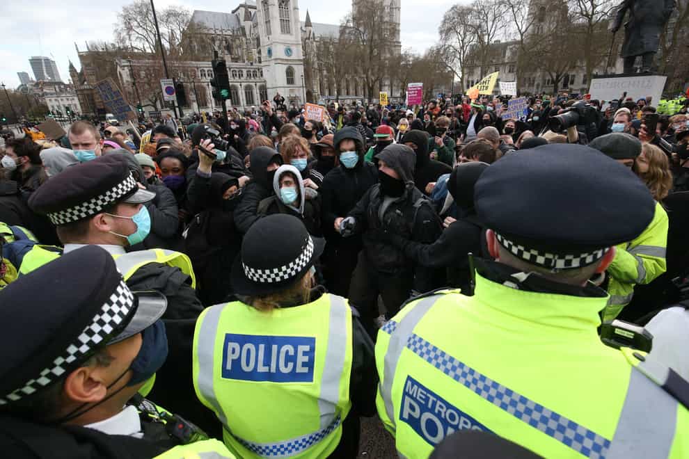Police push back demonstrators during a Kill The Bill protest in Parliament Square on Saturday