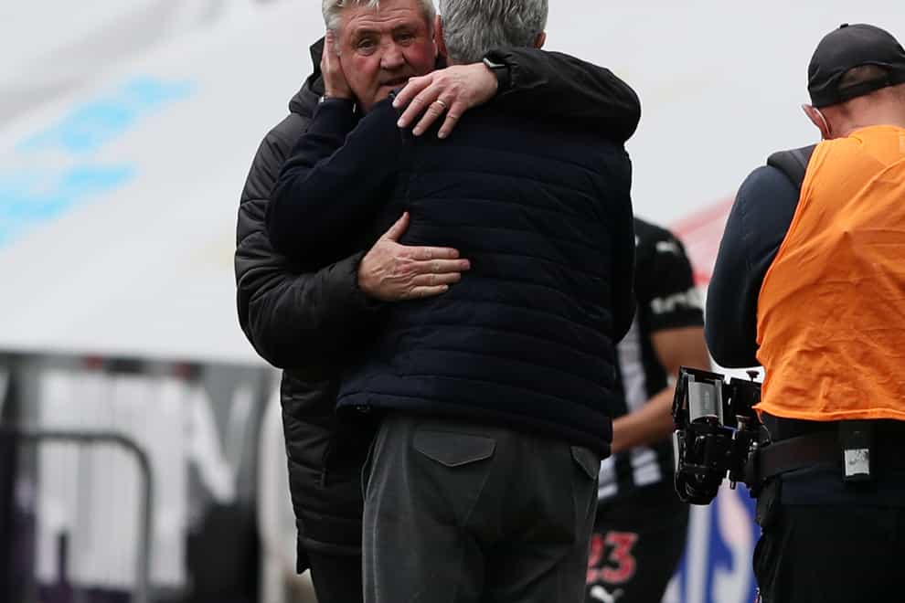 Newcastle head coach Steve Bruce and Tottenham manager Jose Mourinho embrace after the 2-2 draw at St James' Park