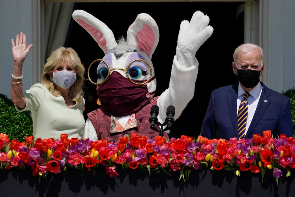 President Joe Biden appears with first lady Jill Biden and the Easter Bunny on the Blue Room balcony at the White House (Evan Vucci/AP)