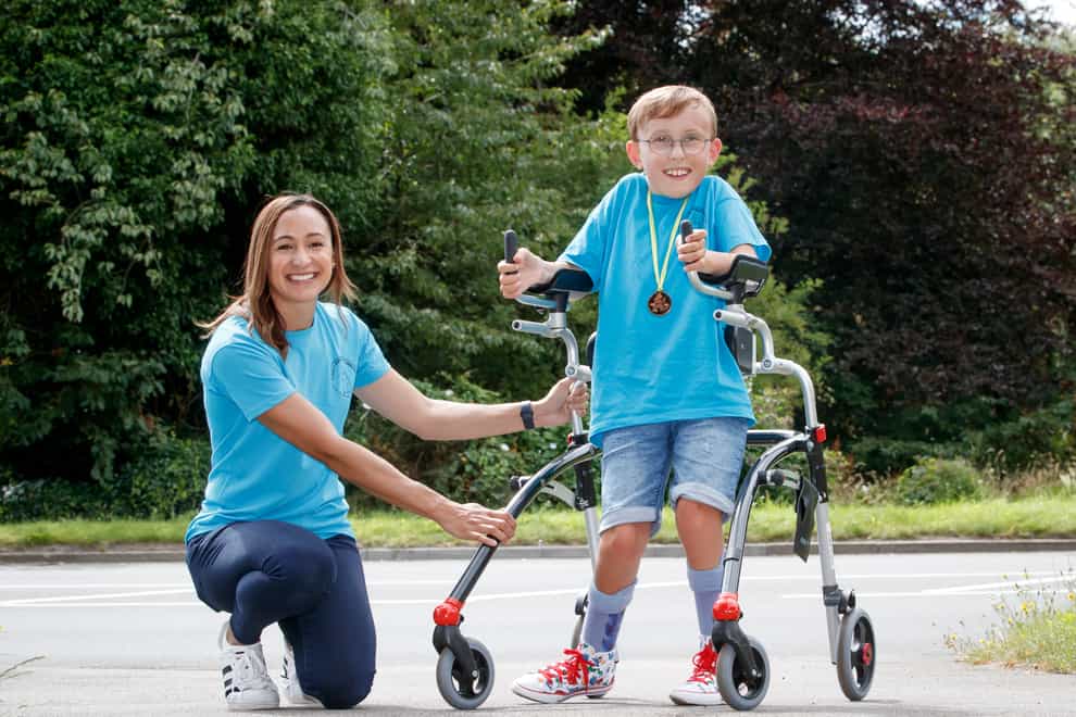 Tobias Weller, who has cerebral palsy and autism, alongside Olympic athlete Jessica Ennis-Hill,