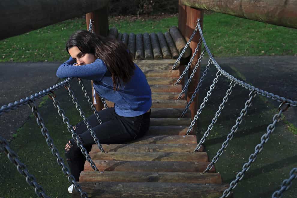 Picture posed by a model, depicting a teenage girl alone
