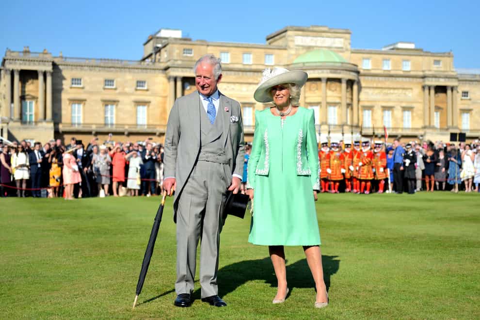 The Prince of Wales and the Duchess of Cornwall during a garden party at Buckingham Palace