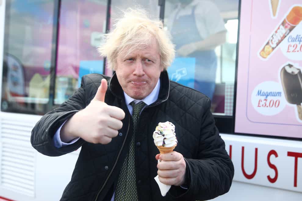 Prime Minister Boris Johnson gives a thumbs-up gesture after being served an ice cream (Tom Nicholson/PA)