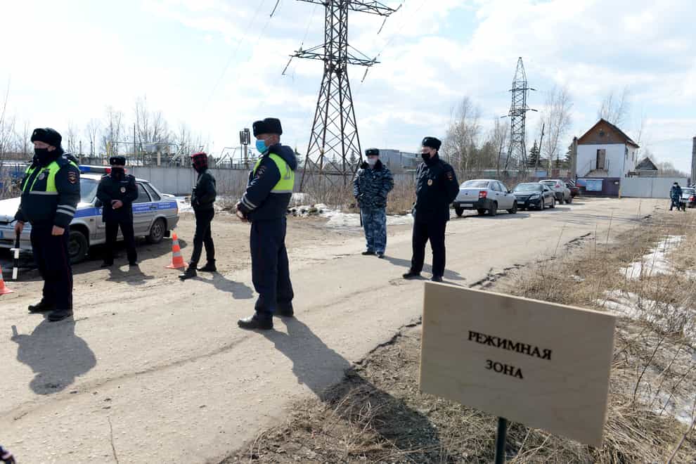 Police officers stand at the ntrance of the prison colony IK-2 (Denis Kaminev/AP)