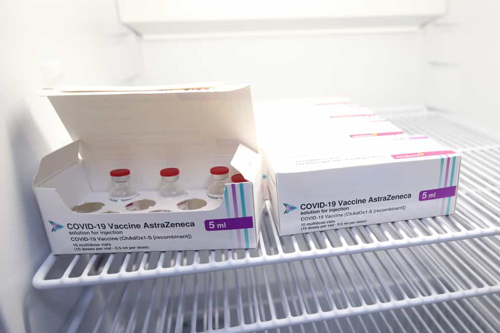 Vials of the Oxford/AstraZeneca coronavirus vaccine are stored in a temperature-controlled fridge