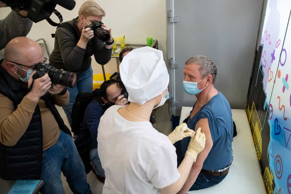 A medical worker administers a jab of Russia’s Sputnik V coronavirus vaccine in Moscow, Russia (Pavel Golovkin/AP)