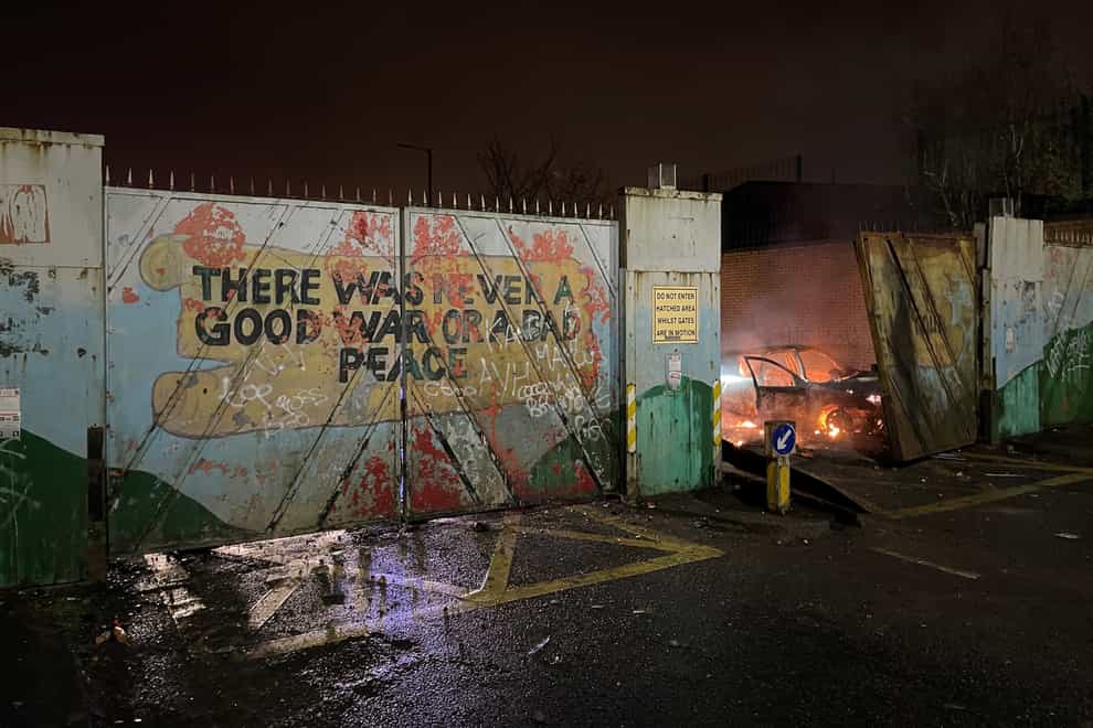 A car on fire at the Peace Gates in Lanark Way, Belfast (Liam McBurney/PA)
