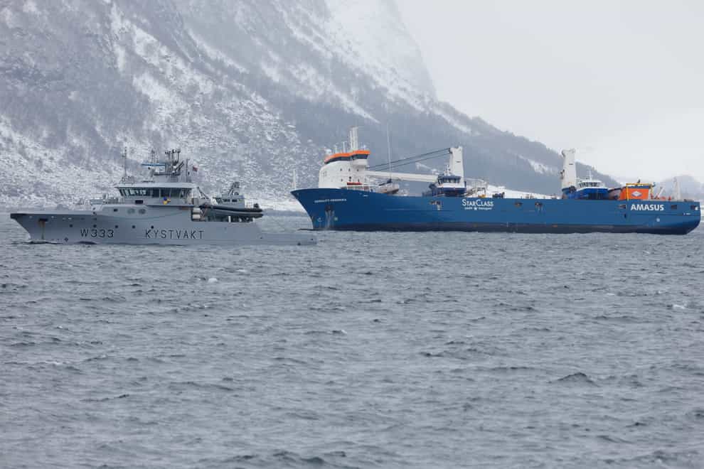 The Dutch cargo ship Eemslift Hendrika is guided to land at Alesund, Norway