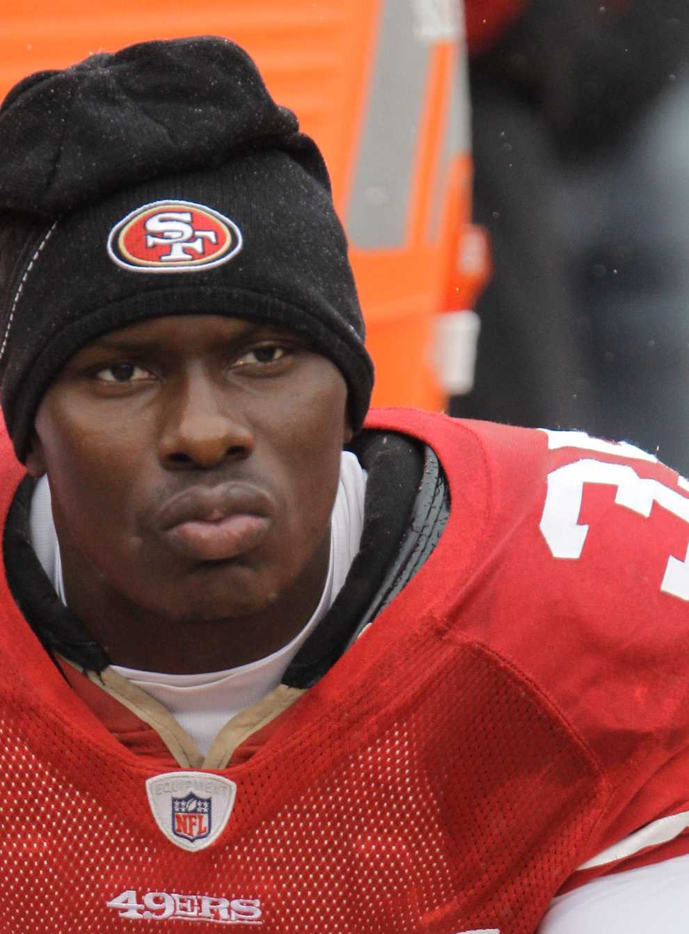 Phillip Adams sits on the bench in his San Francisco 49ers' uniform