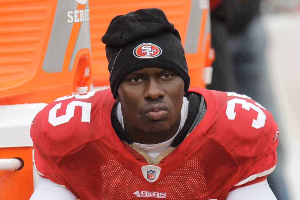 Phillip Adams sits on the bench in his San Francisco 49ers' uniform