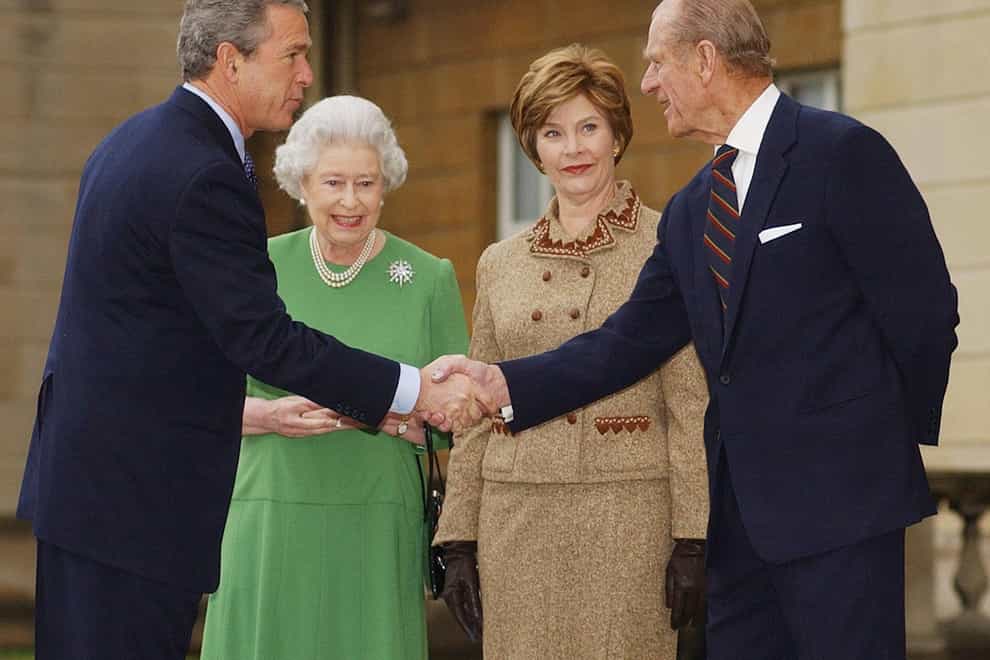 Then US president George Bush shakes hands with the Duke of Edinburgh in 2003