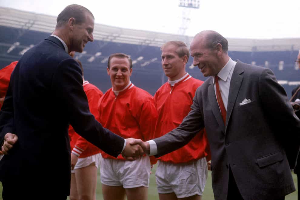 The Duke of Edinburgh greets Manchester United manager Matt Busby before the 1963 FA Cup final