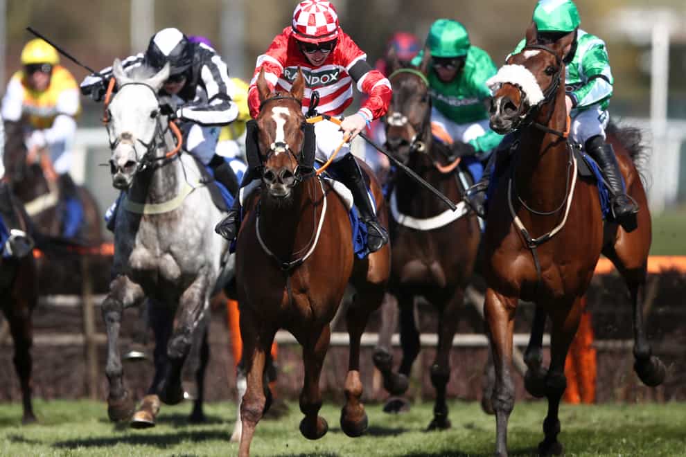 Tronador (red) powers clear after the last at Aintree
