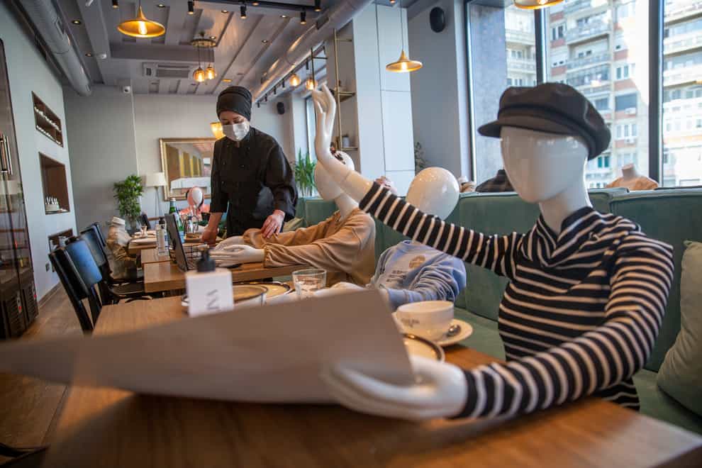 Mannequins are positioned at the tables of Bagolina eatery restaurant, as a protest against the latest government Covid-19 lockdown measures in Kosovo capital Pristina