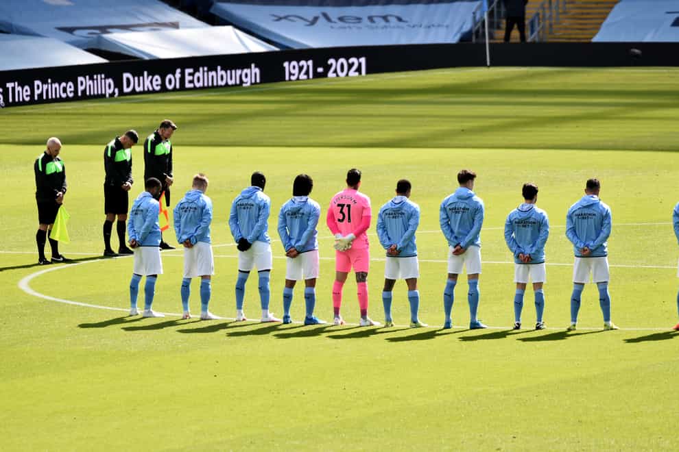 Manchester City players stand for a two-minute silence prior to kick-off against Leeds