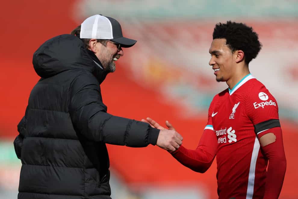 Liverpool manager Jurgen Klopp congratulates Liverpool’s Trent Alexander-Arnold