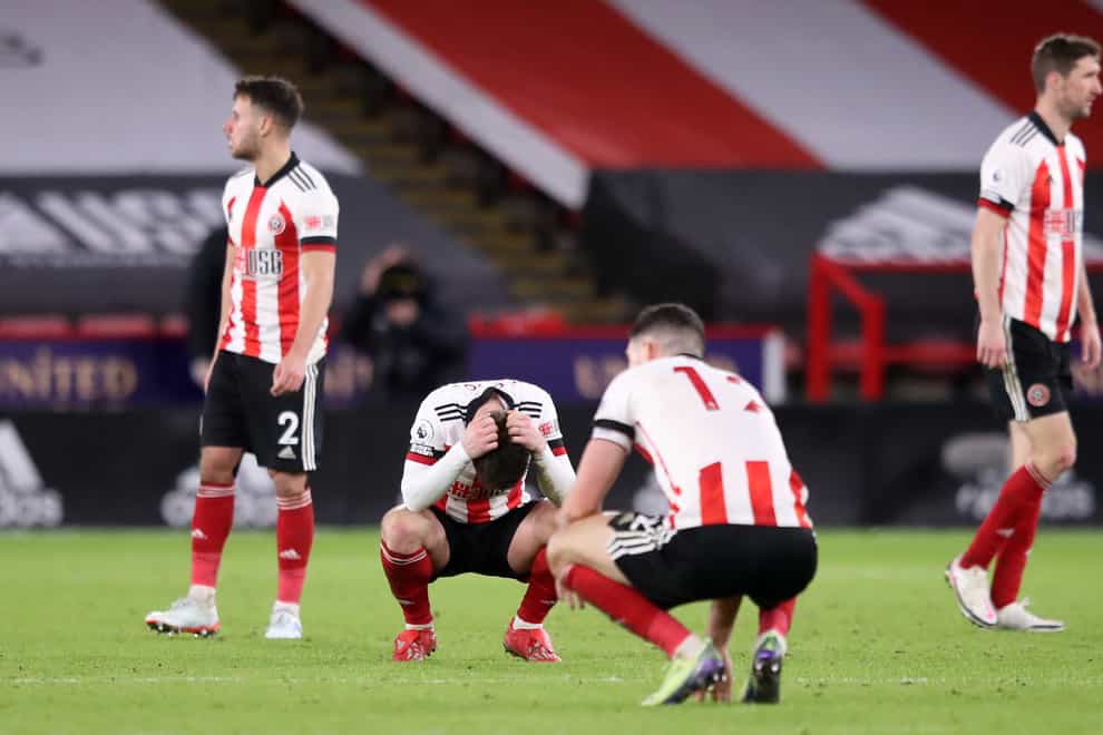 Sheffield United players react after a Premier League match against Everton
