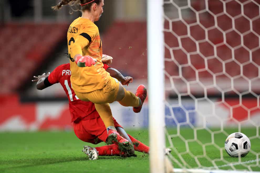 Nichelle Prince, left, pounces on a mistake from Karen Bardsley to score the second goal