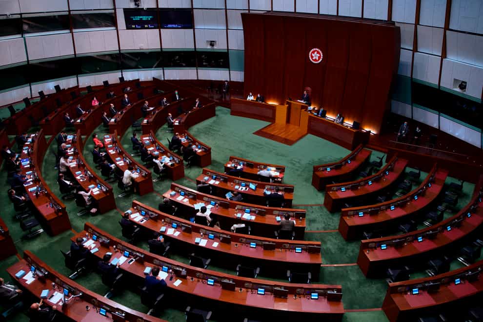 Pro-China legislators attend the first and second reading of the Improving Electoral System (Consolidated Amendments) Bill 2021 at the Legislative Council in Hong Kong