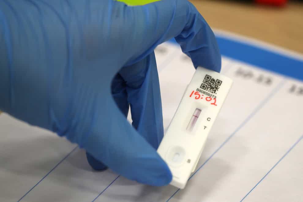 People carry out asymptomatic testing using lateral flow tests (Andrew Milligan/PA)