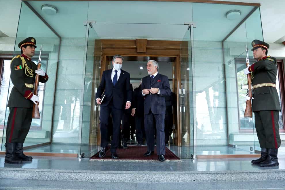 Abdullah Abdullah, Chairman of the High Council for National Reconciliation, walks with US Secretary of State Antony Blinken, at the Sapidar Palace in Kabul