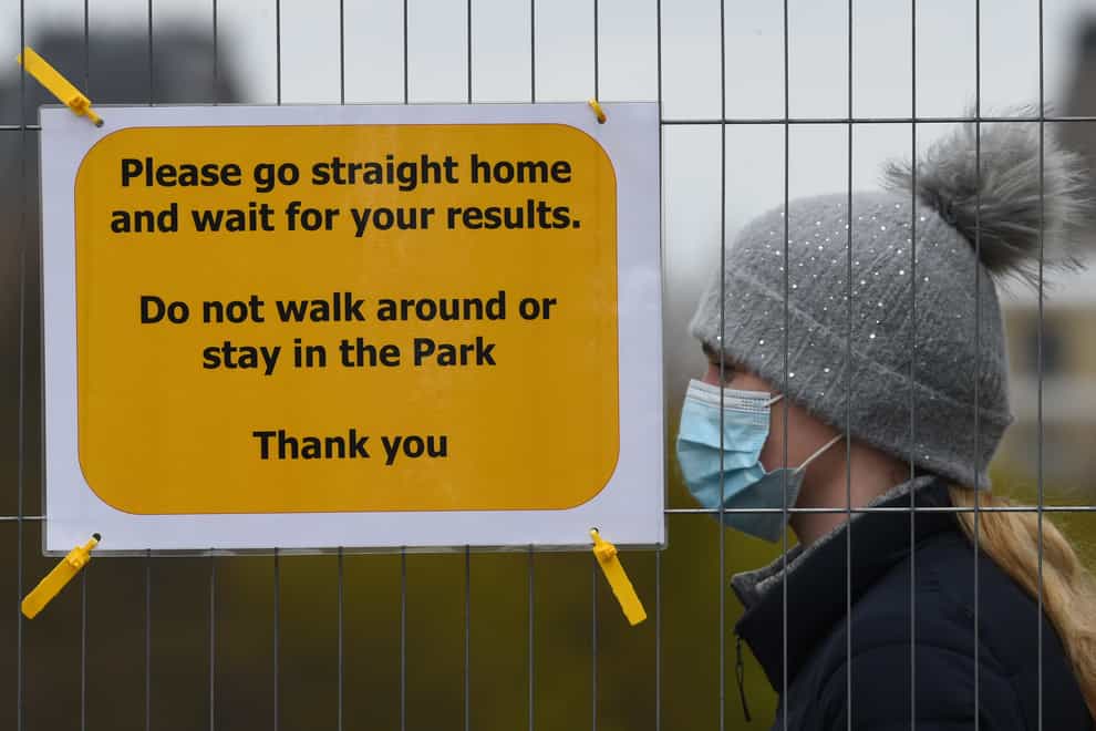 People take part in coronavirus surge testing on Clapham Common
