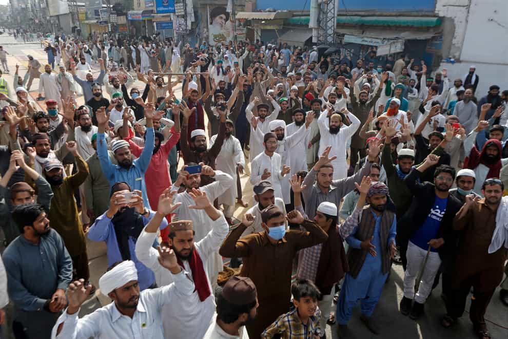 Supporters of Tehreek-e-Labiak Pakistan, a radical Islamist political party, chant slogans during a protest against the arrest of their party leader, Saad Rizvi, in Lahore, Pakistan (K.M. Chaudary/AP)