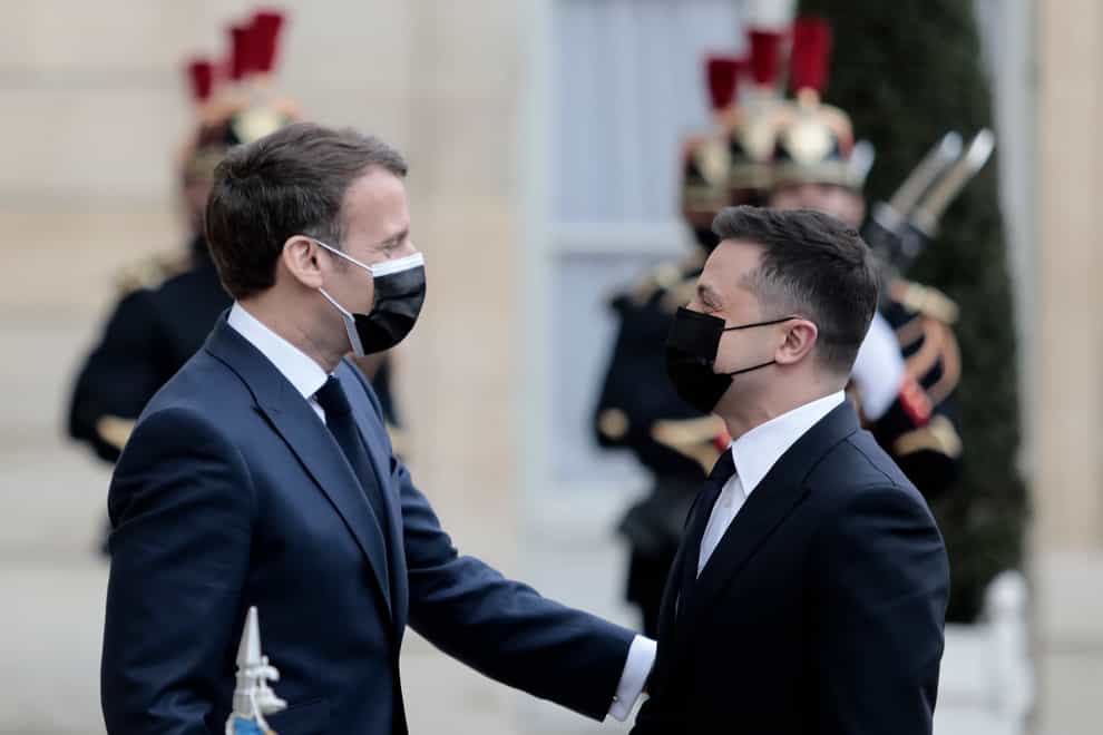 French President Emmanuel Macron, left, welcomes Ukrainian President Volodymyr Zelenskyy at the Elysee palace (Lewis Joly/Associated Press)