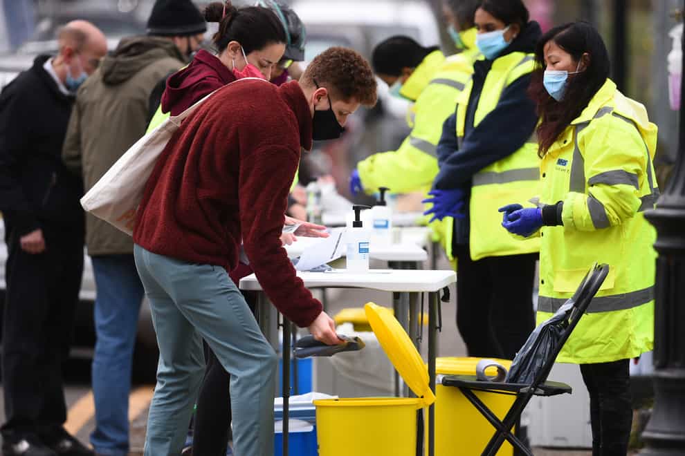 People take part in coronavirus surge testing on Clapham Common, south London (Kirsty O'Connor/PA)