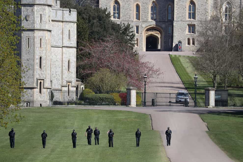 Police officers conduct security checks outside Windsor Castle, Berkshire (Andrew Matthews/PA)