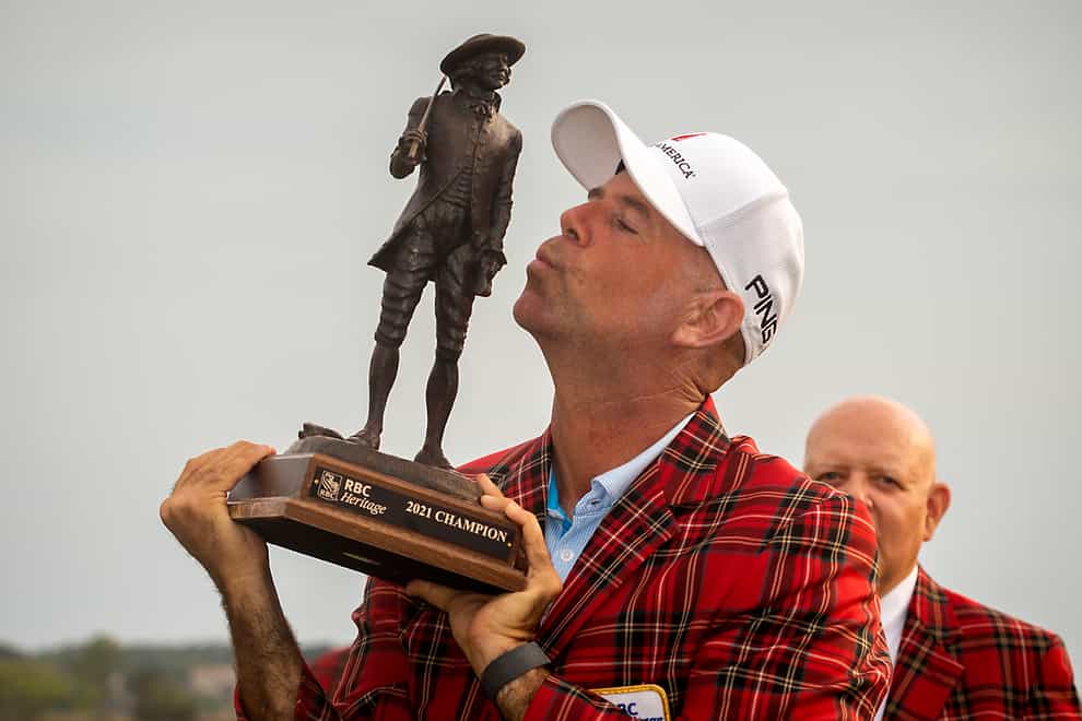 Stewart Cink kisses the championship trophy after winning the final round of the RBC Heritage golf tournament in Hilton Head Island