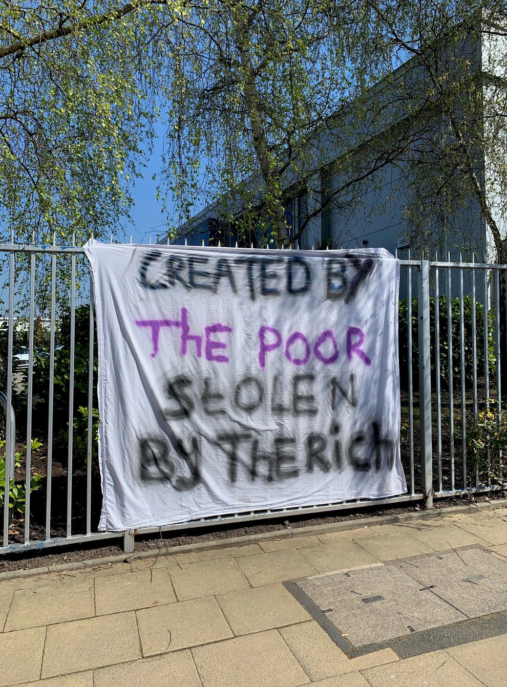 Created by the poor stolen by the rich banner