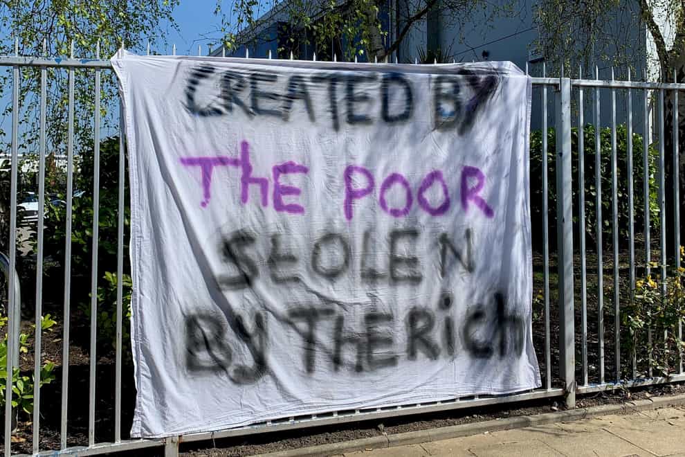 Created by the poor stolen by the rich banner