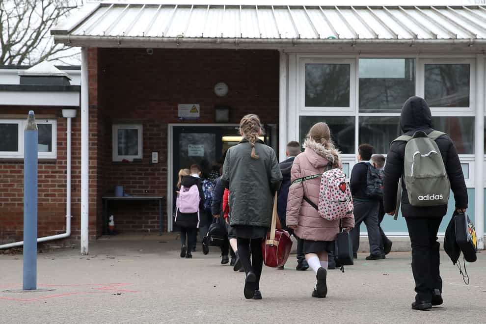 Children walk into school