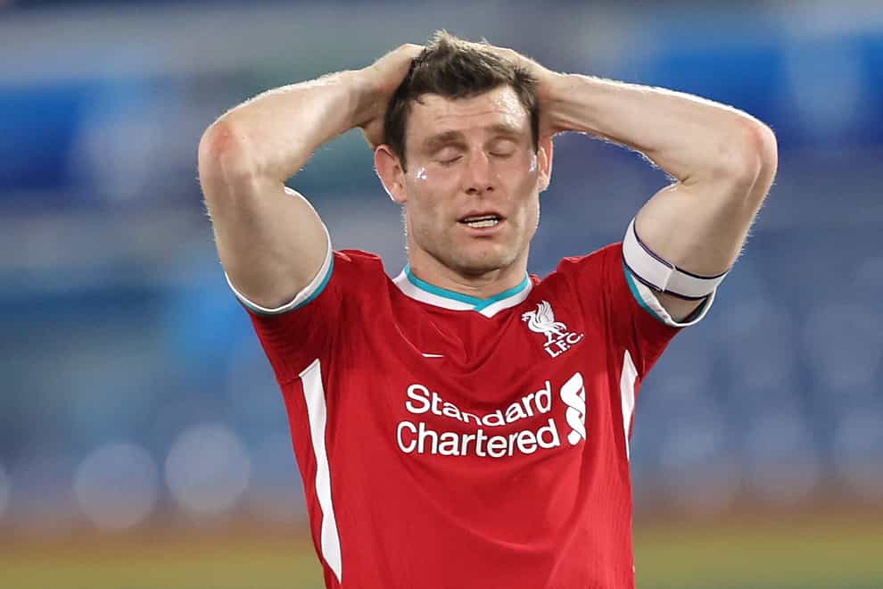 James Milner clasps his hands together on the back of his head