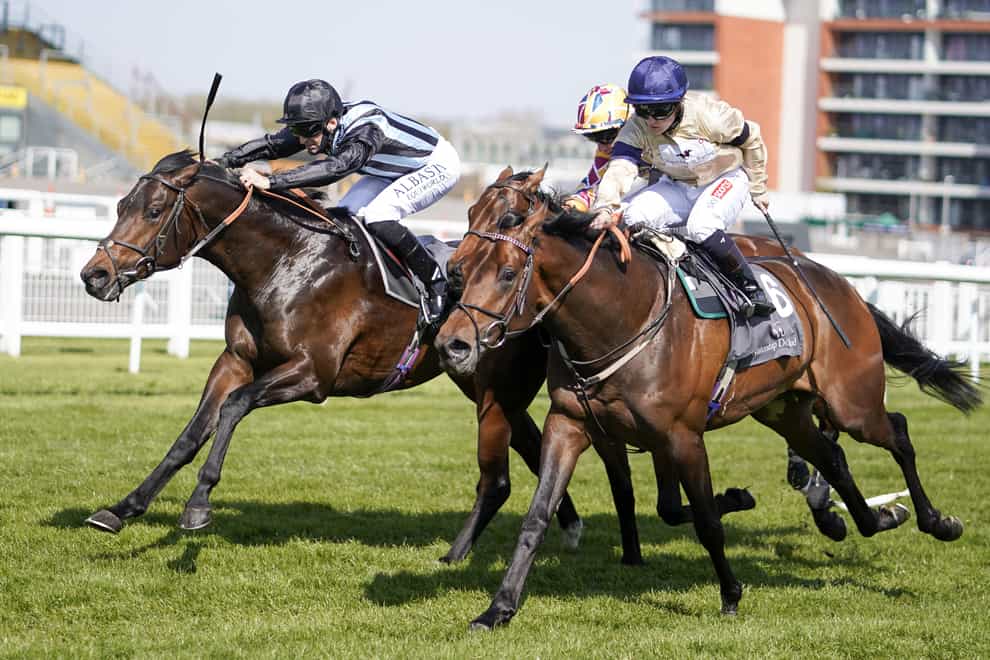 Mehmento (right) in action at Newbury