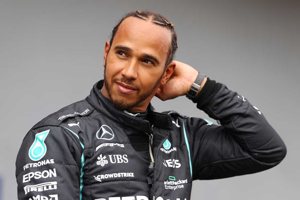 Lewis Hamilton looks on