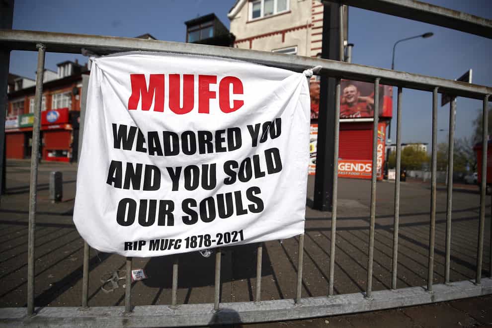 An Old Trafford banner protests against Super League plans involving Manchester United