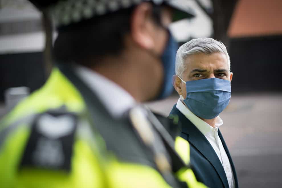 Labour’s Mayor of London Sadiq Khan looks across to a Metropolitan Police officer