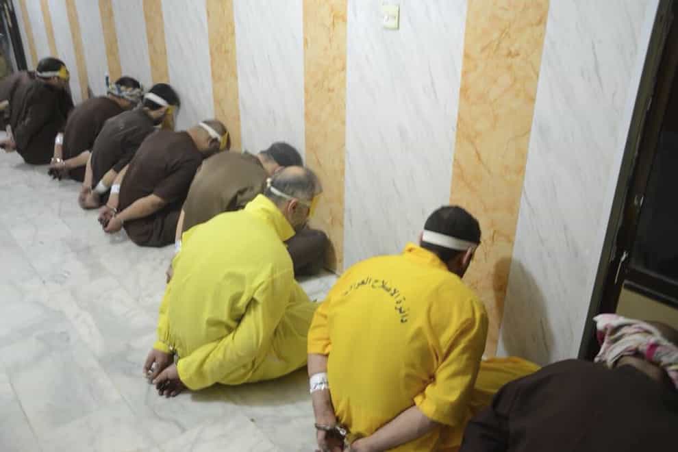 Blindfolded prisoners await their executions in Iraq