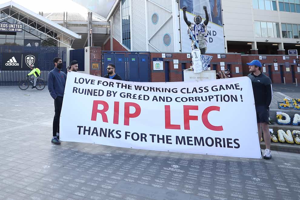 Liverpool fans protest with banners