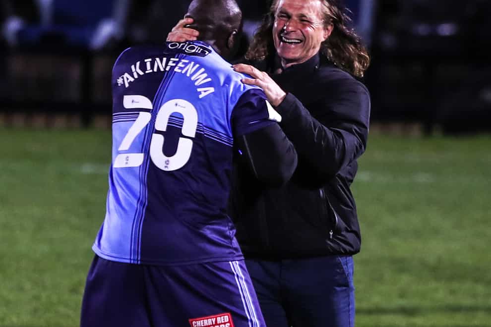Adebayo Akinfenwa (left) celebrates with Wycombe Wanderers manager Gareth Ainsworth (right)