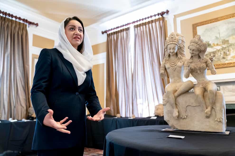 Afghan ambassador to the US Roya Rahmani at the Afghanistan embassy in Washington with looted and stolen Afghan religious relics and antiquities recovered by US government authorities