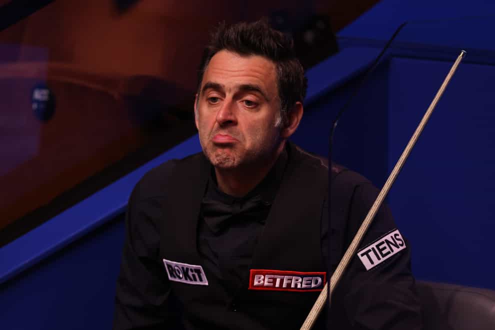 Ronnie O'Sullivan, pictured, trails Anthony McGill