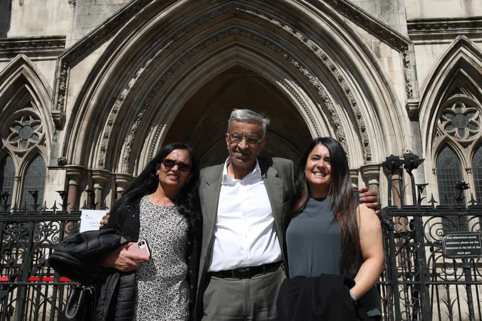 Former post office worker Vijay Parekh from Willesden, with his wife Gita (left) and daughter Bhavisha (Yui Mok/PA)