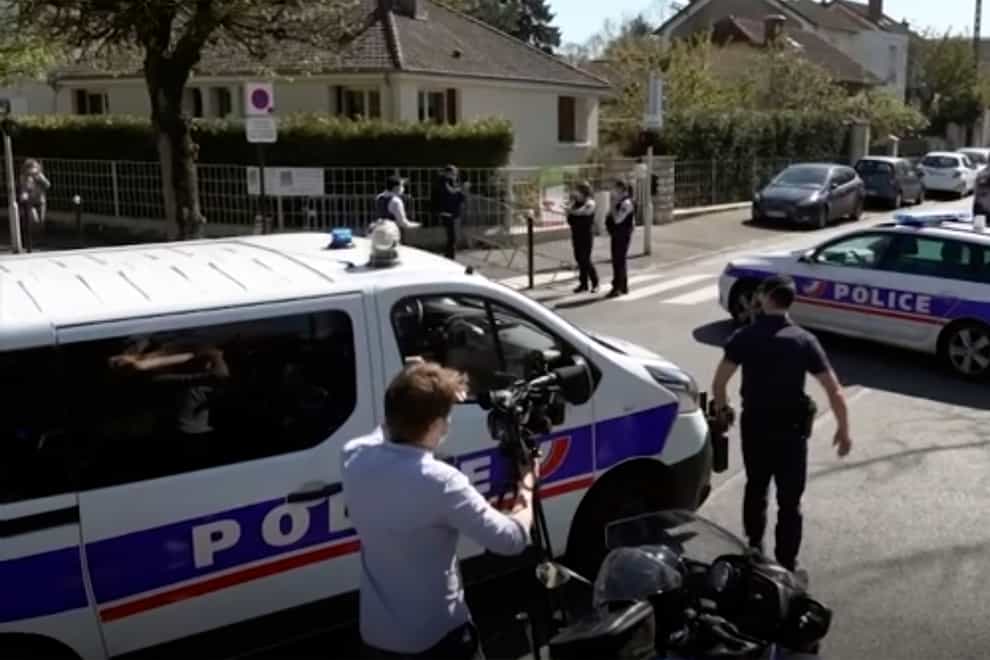 Police near the scene of a stabbing at a police station in Rambouillet, south-west of Paris